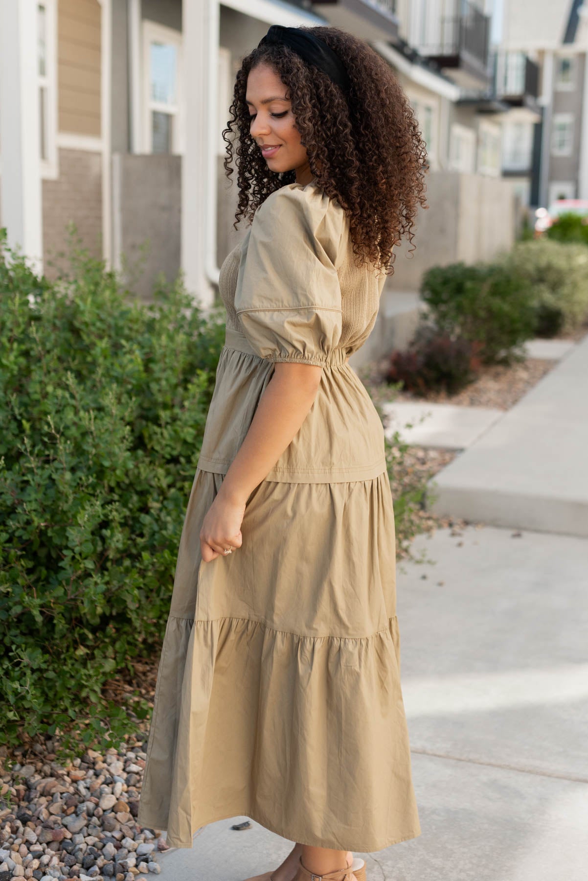 Side view of the light olive poplin bodice dress