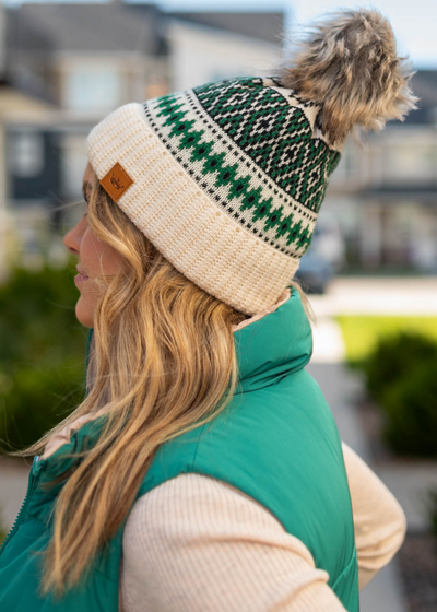 Side view of a dark green beanie