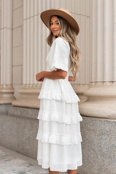 Side view of the white tiered textured dress