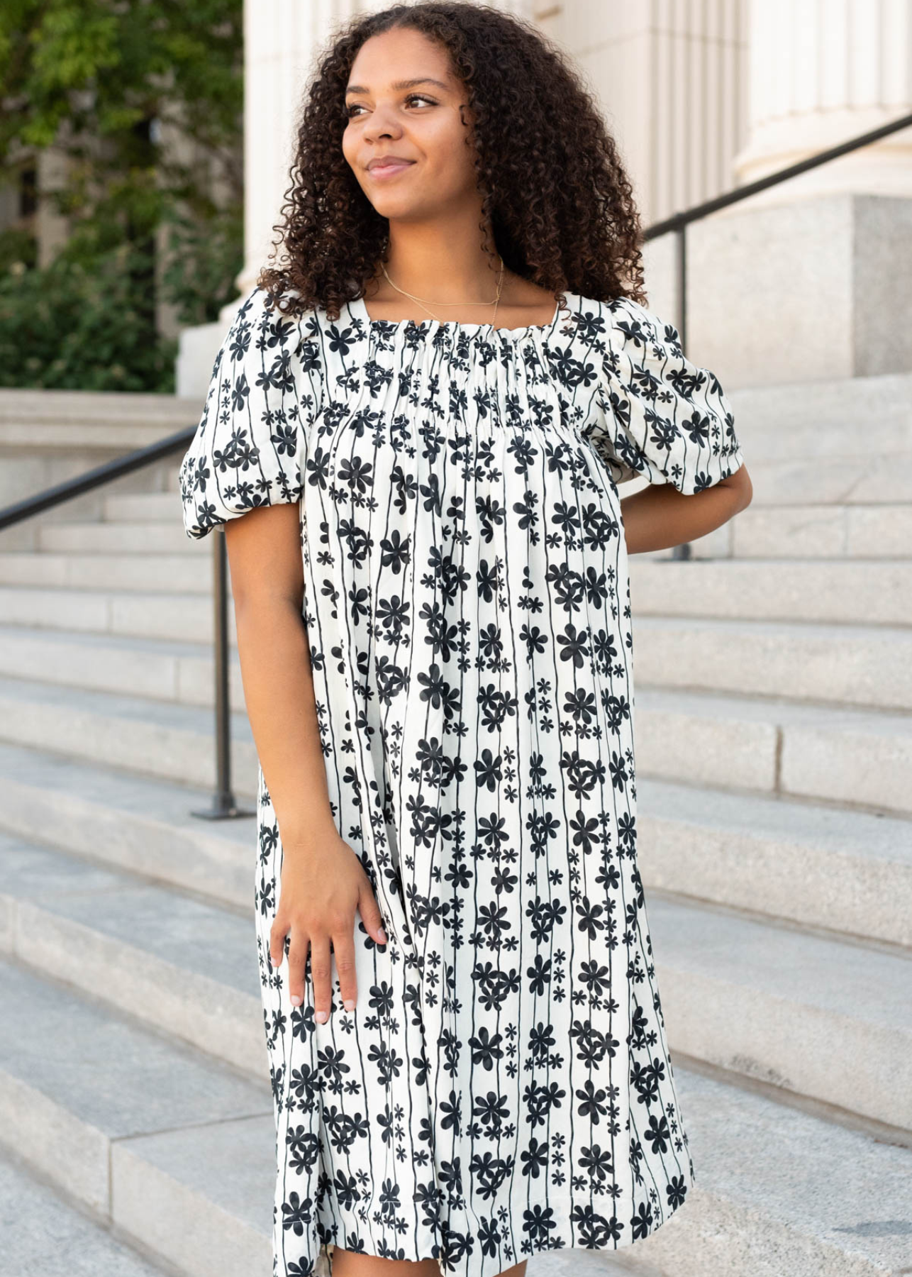 Cream black floral dress with pleats at the neck