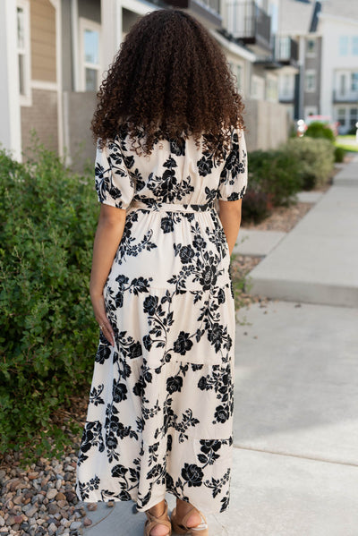 Back view of the cream floral button tiered dress