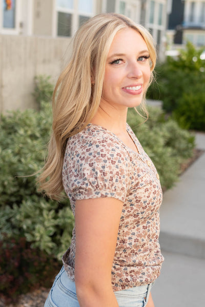 Side view of the ivory floral top