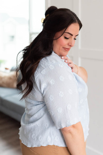 Side view of the plus size dusty blue top