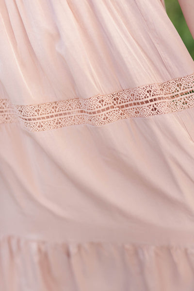 Close up of the trim on the plus size blush dress