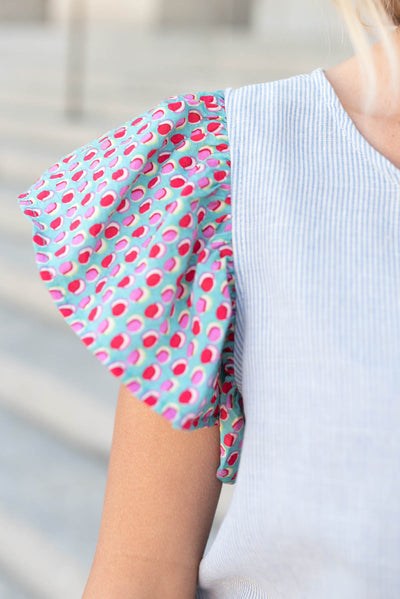 Close up of the sleeve on the blue stripe pattern top