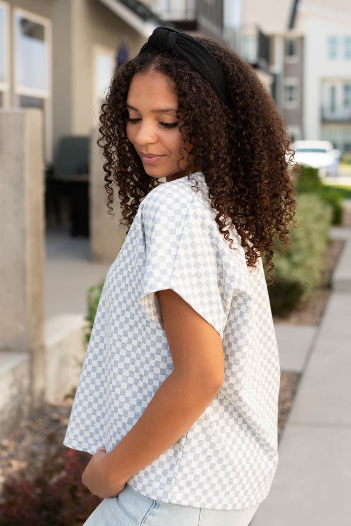 Side view of the heather grey checkered top