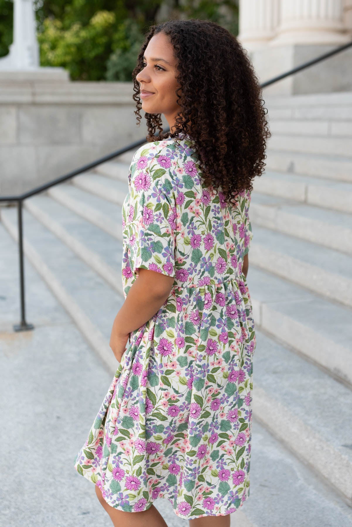 Side view of the ivory multi floral dress