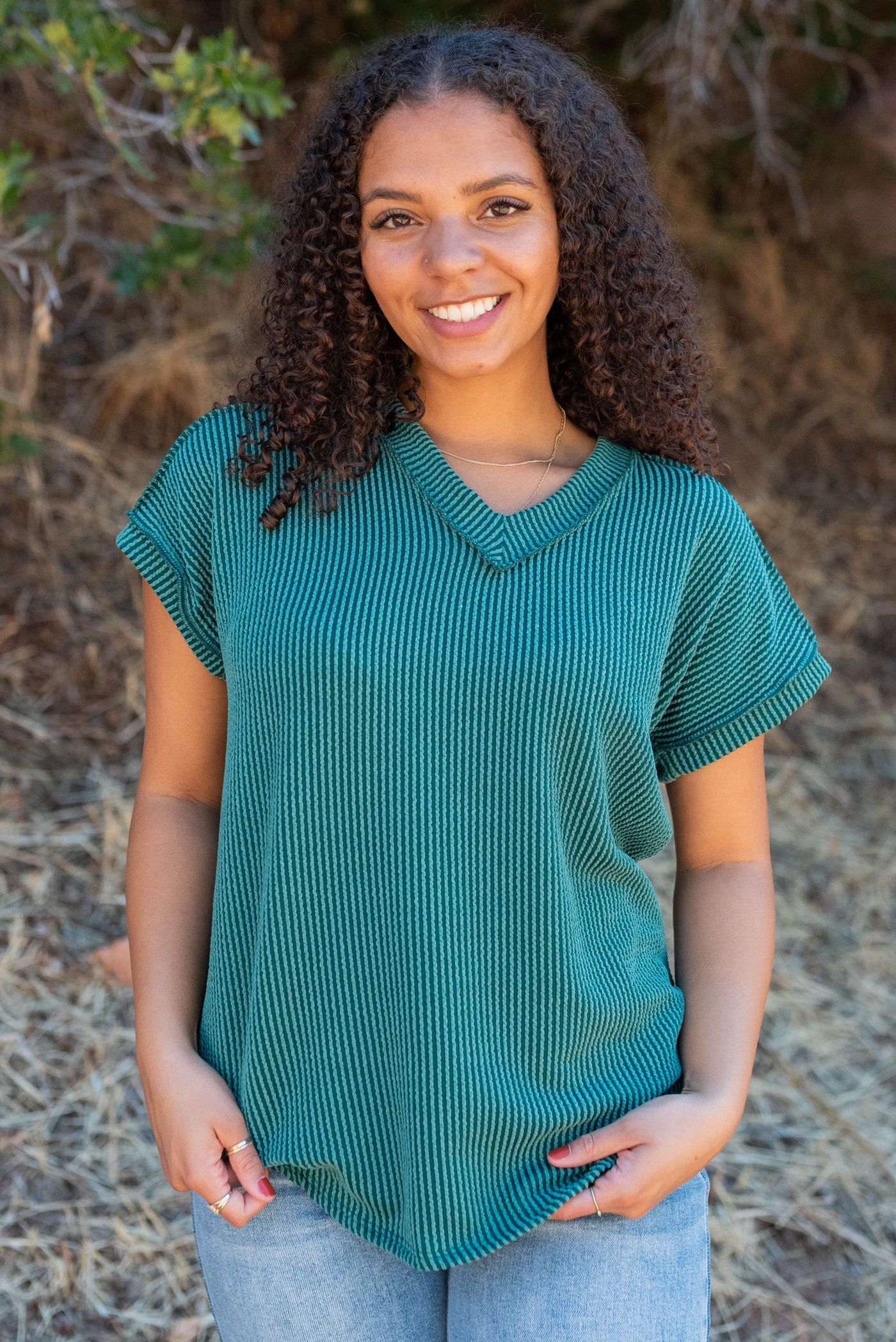 Hunter green ribbed top with a v-neck