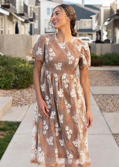 Brown embroidered dress with lace on hem and cuffs