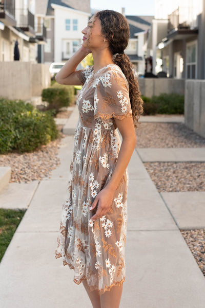 Side view of the brown embroidered dress