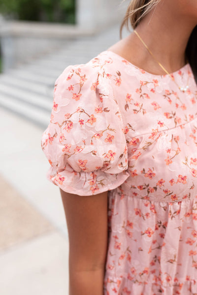 Close up of the sleeve and fabric on The pink floral dress