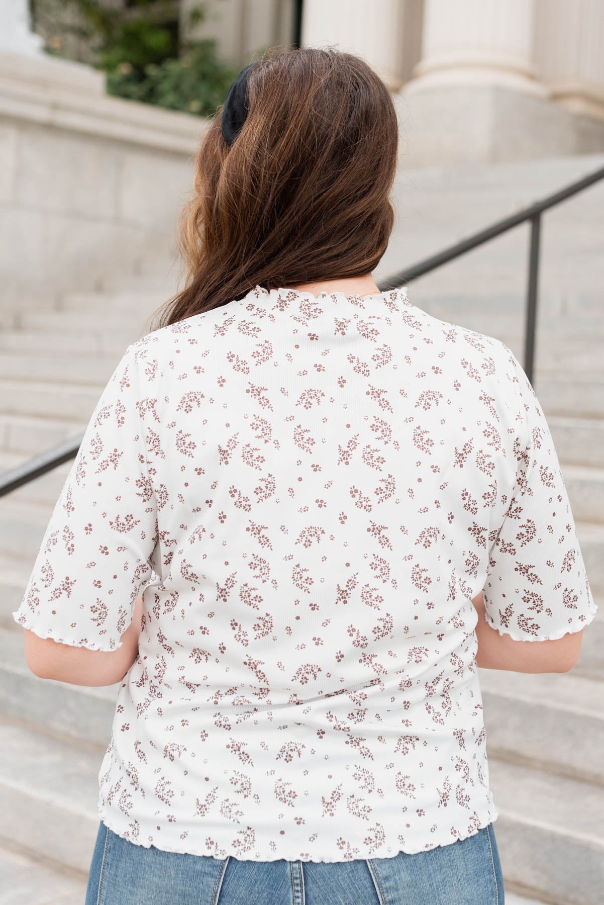 Back view of the plus size ivory floral top