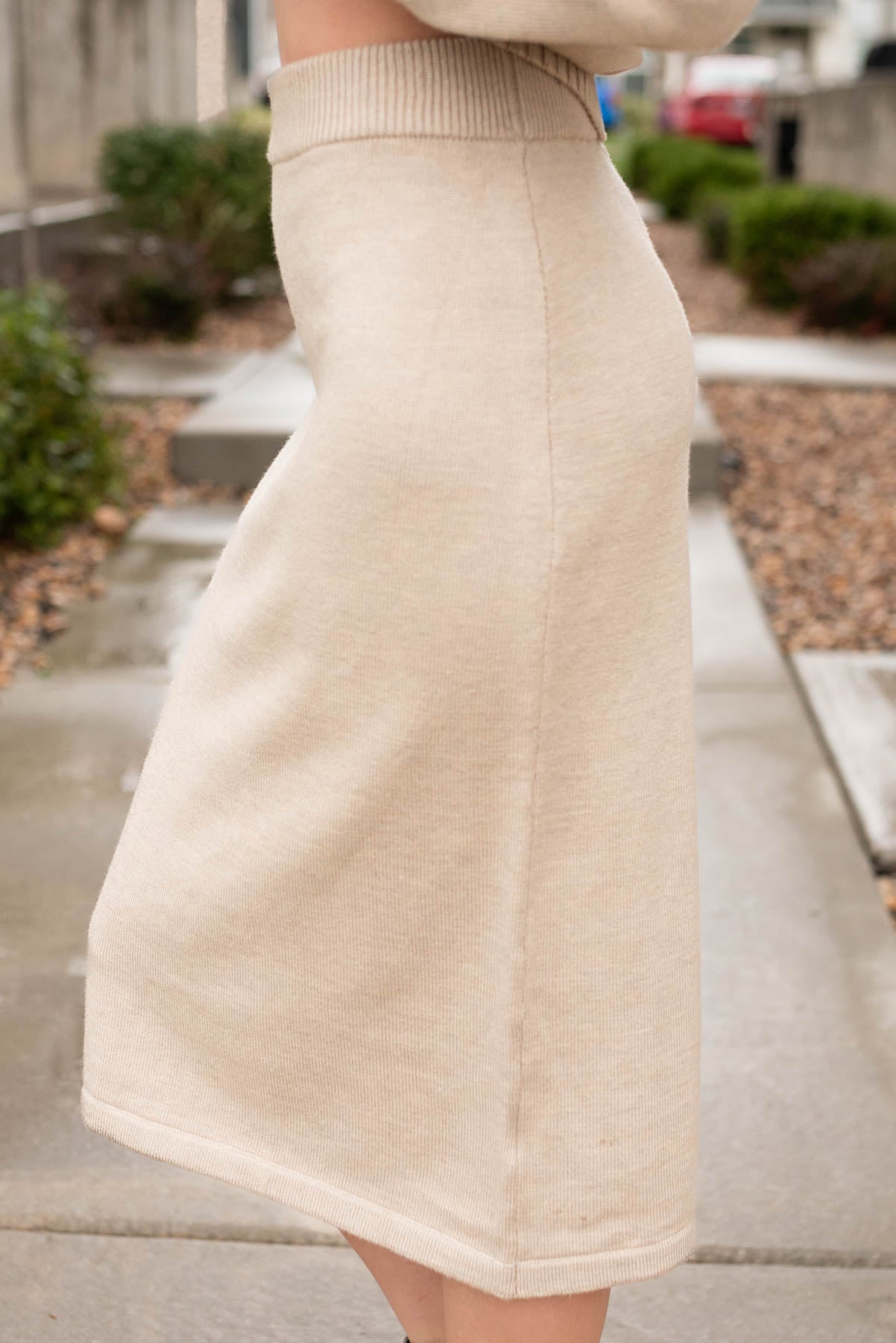 Side view of the taupe sweater skirt