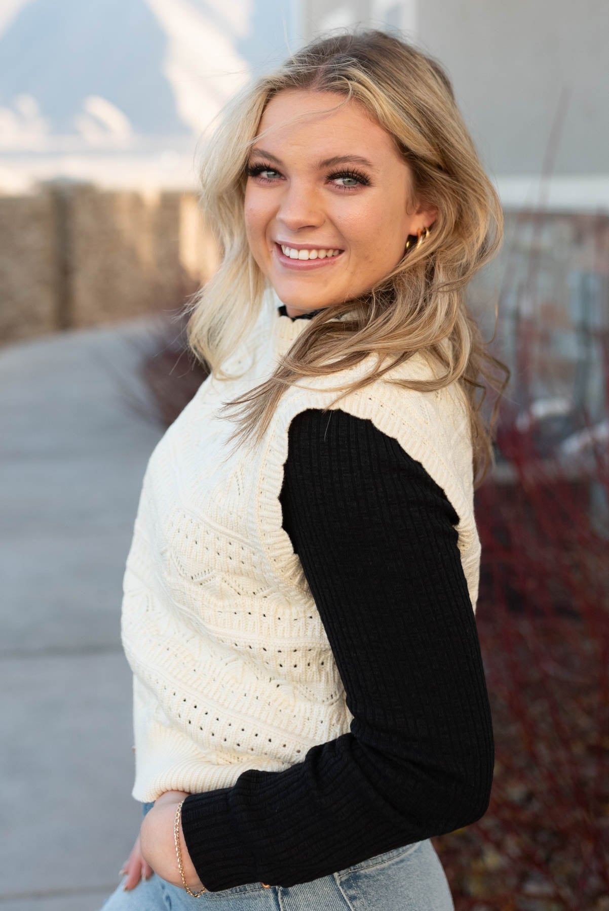 Side view of the ivory knit sweater vest