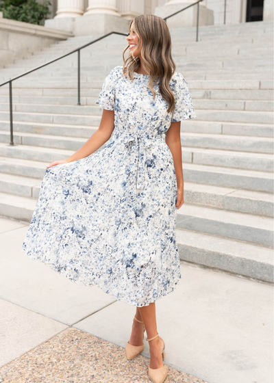 Blue floral pleated dress with a tie at the waist