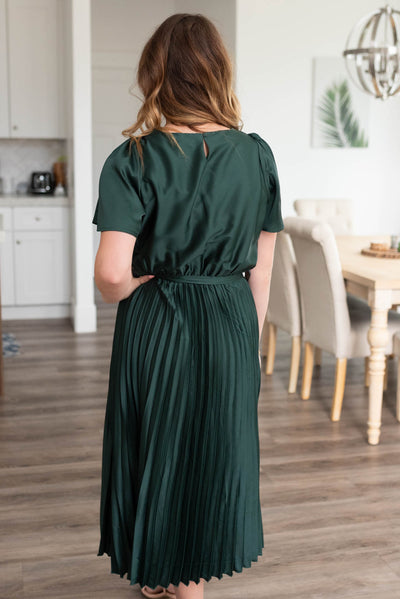 Back view of the hunter green satin pleat dress