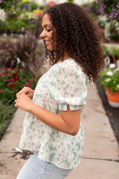 Side view of the green floral blouse