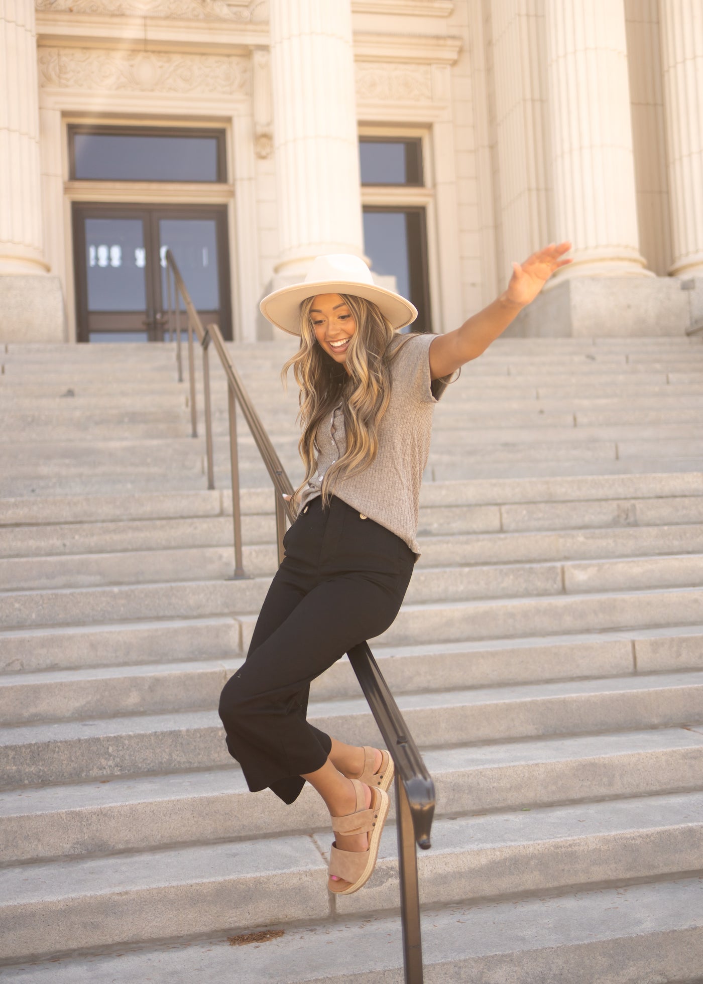 Black crop pants with gold buttons on front