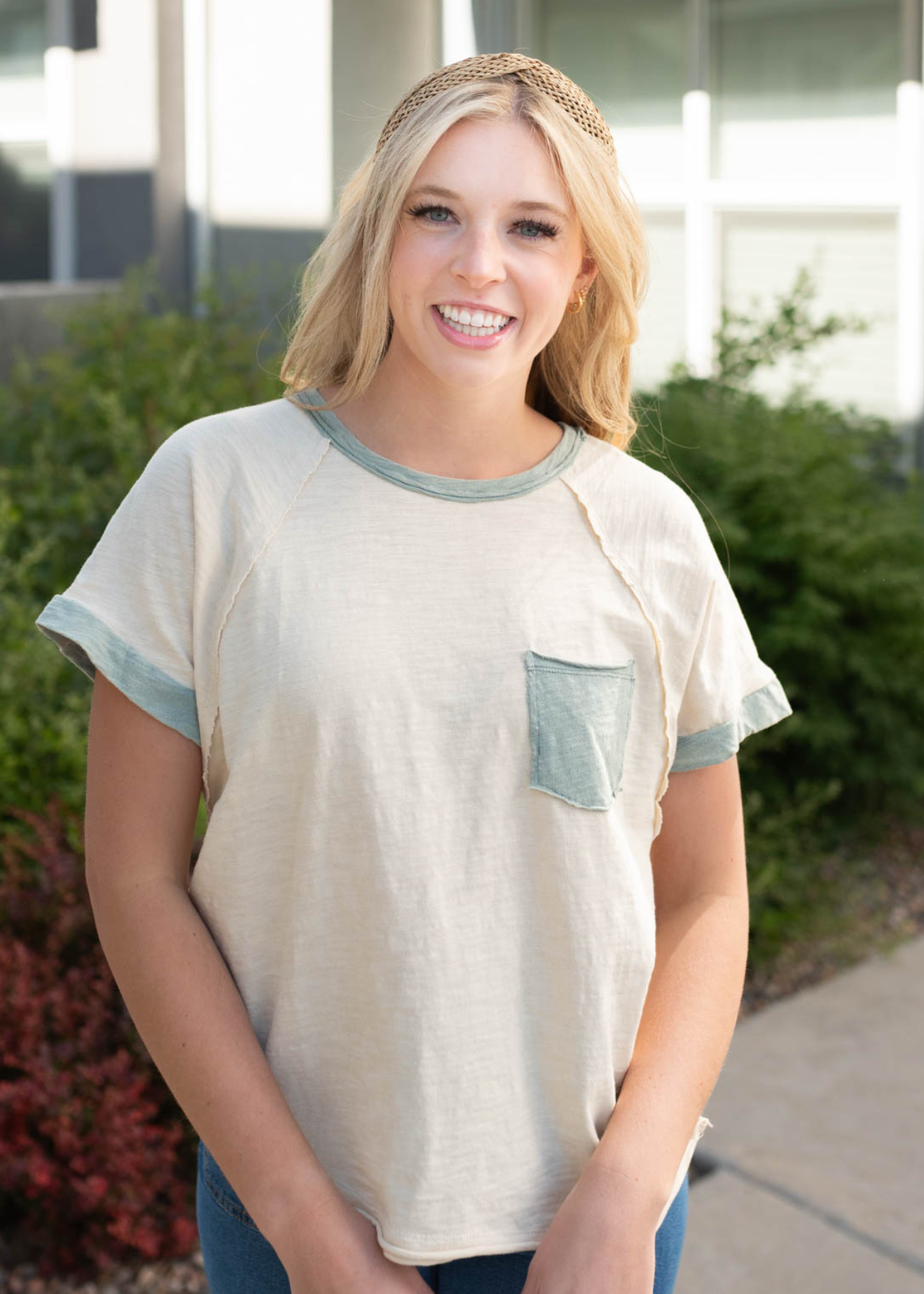 Cream sage pocket top with sage trim on the cuffs and neckline