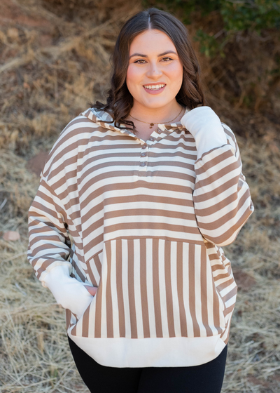 Brown stripe pullover with buttons at the neck