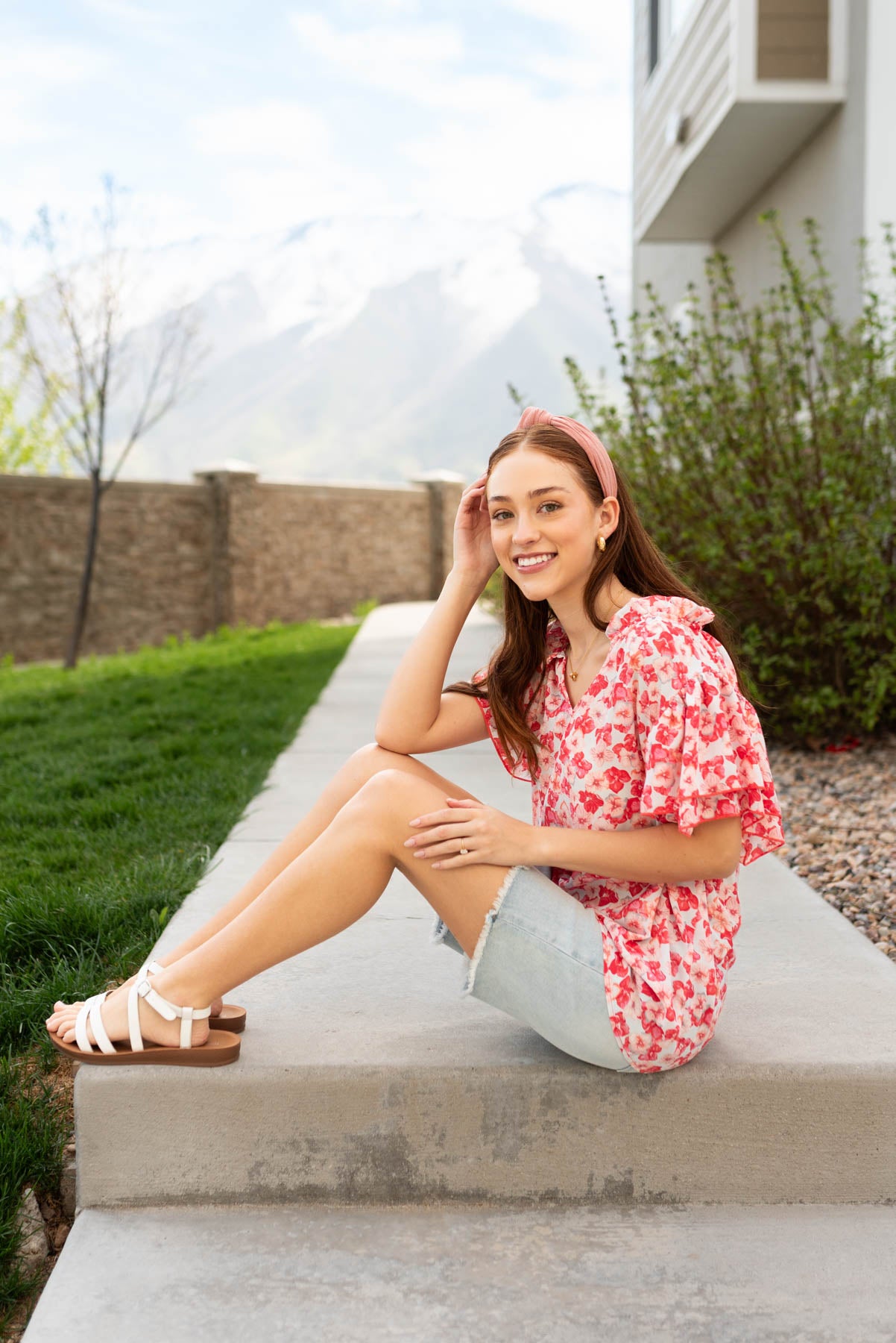 Side view of the pink floral ruffle blouse