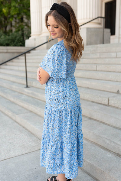 Side view of the blue flroal v-neck dress