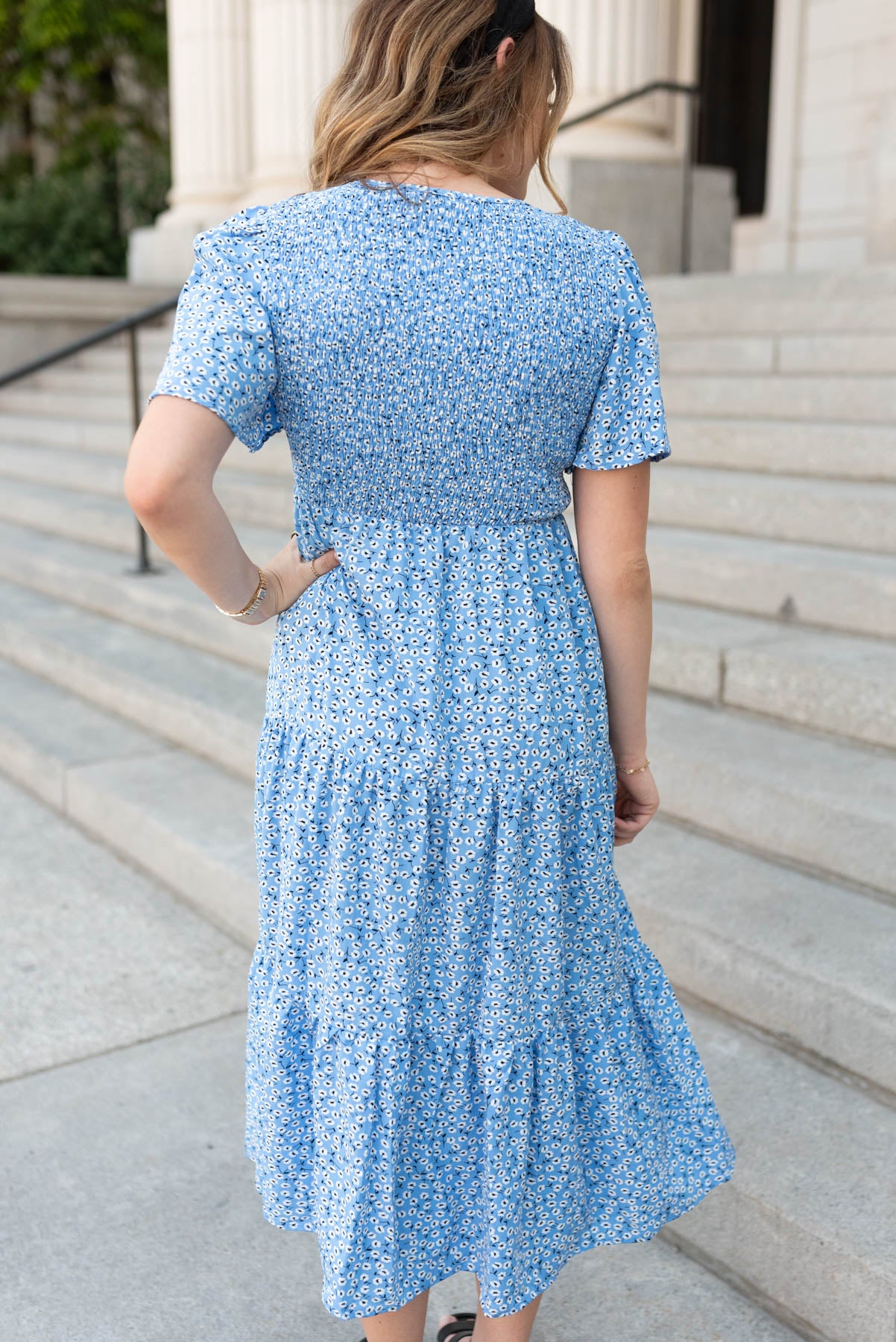 Back view of the blue floral v-neck dress