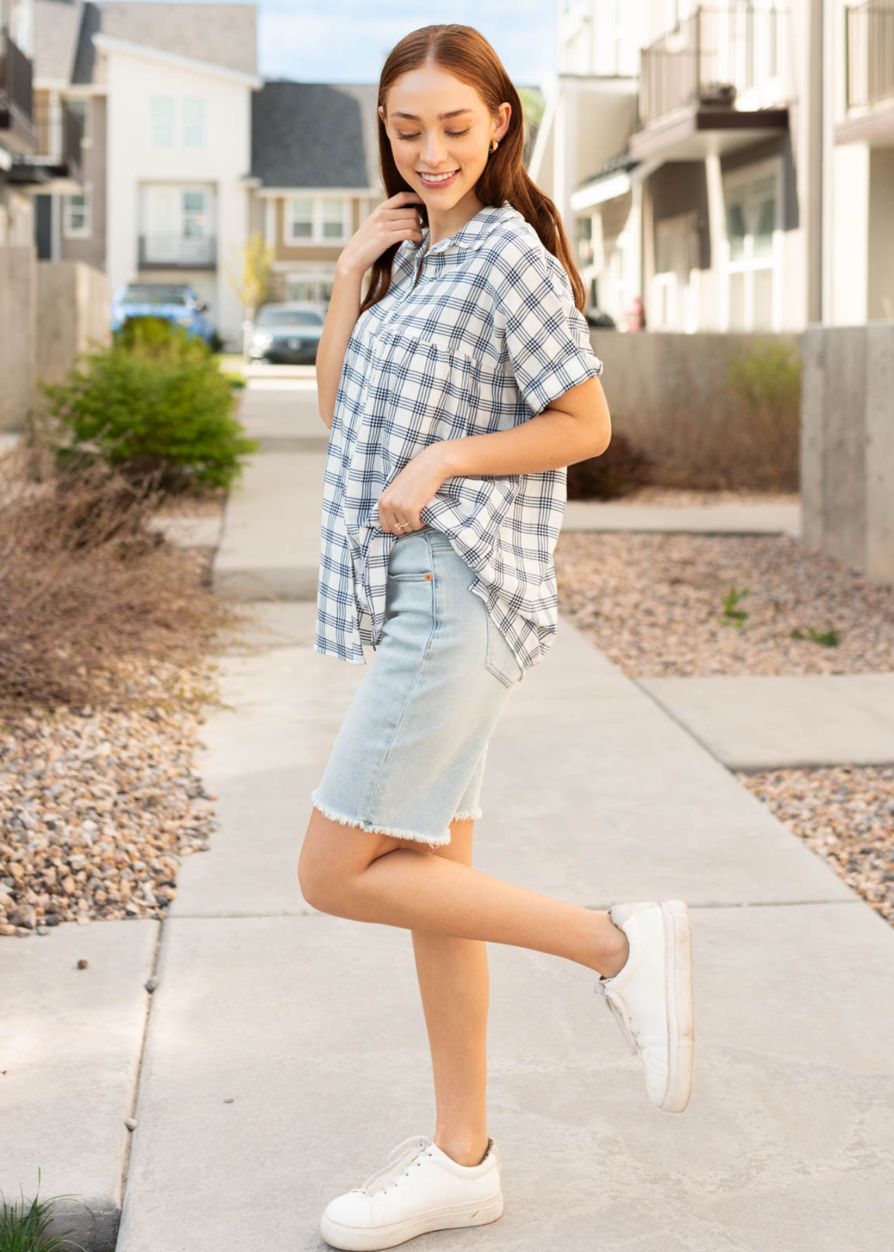 Side view of the navy button down top