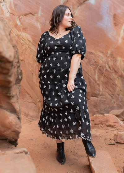 Plus size black floral tiered dress with scalloped hem