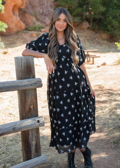 Black floral tiered dress with short sleeves