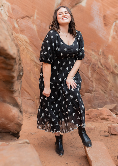 Black floral tiered dress with a v-neck in plus size