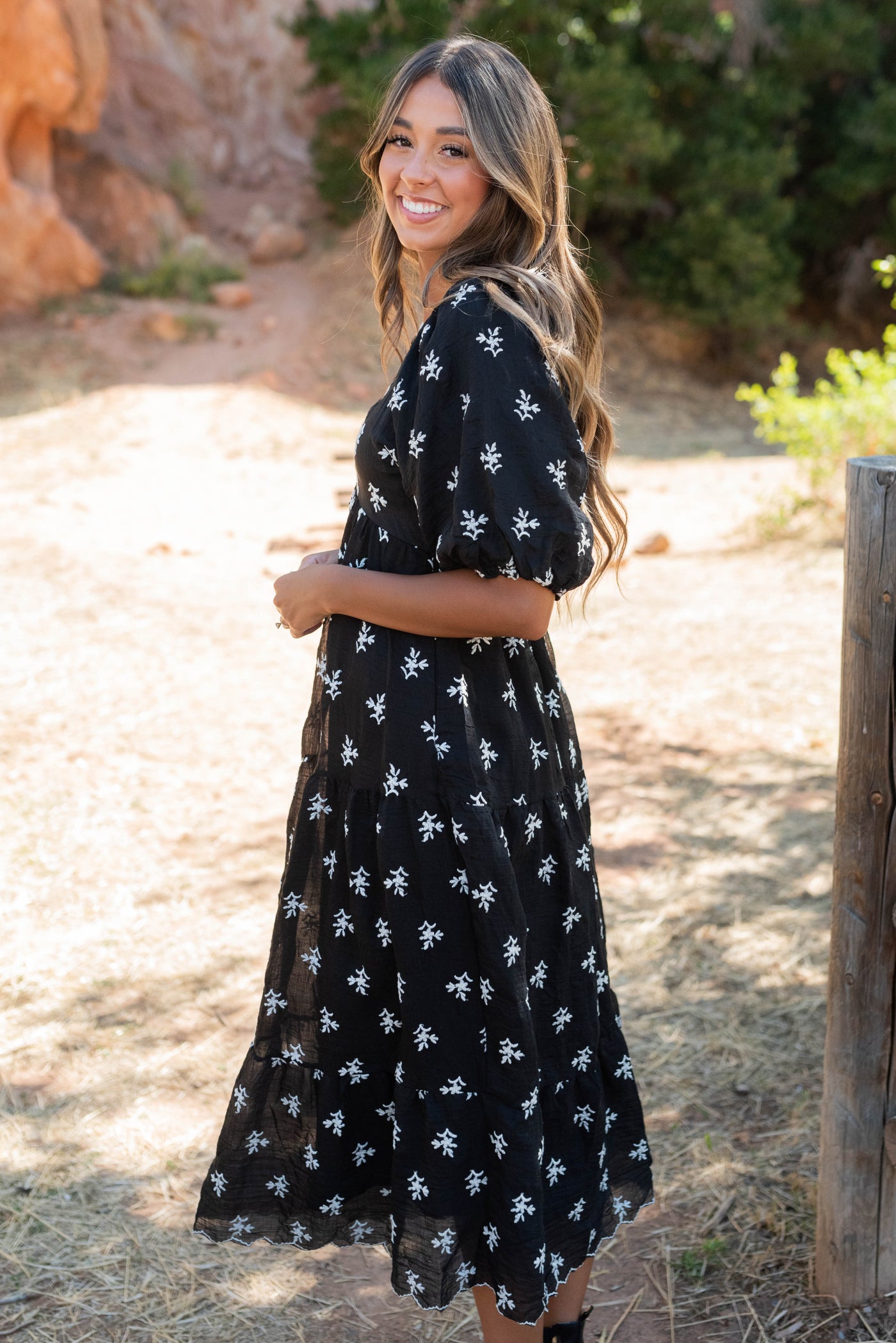 Side view of the black floral tiereddress