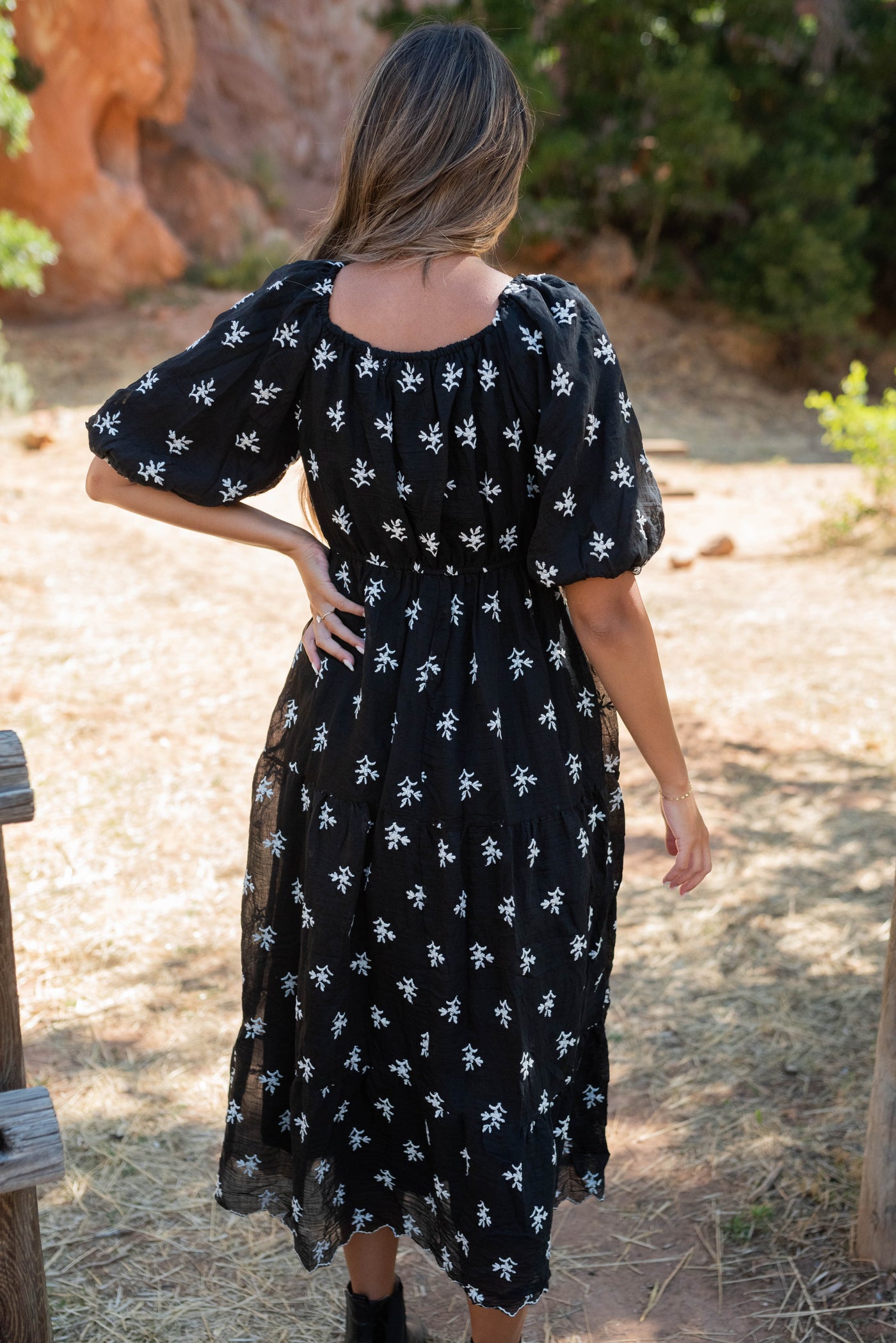 Back view of the black floral tiered dress