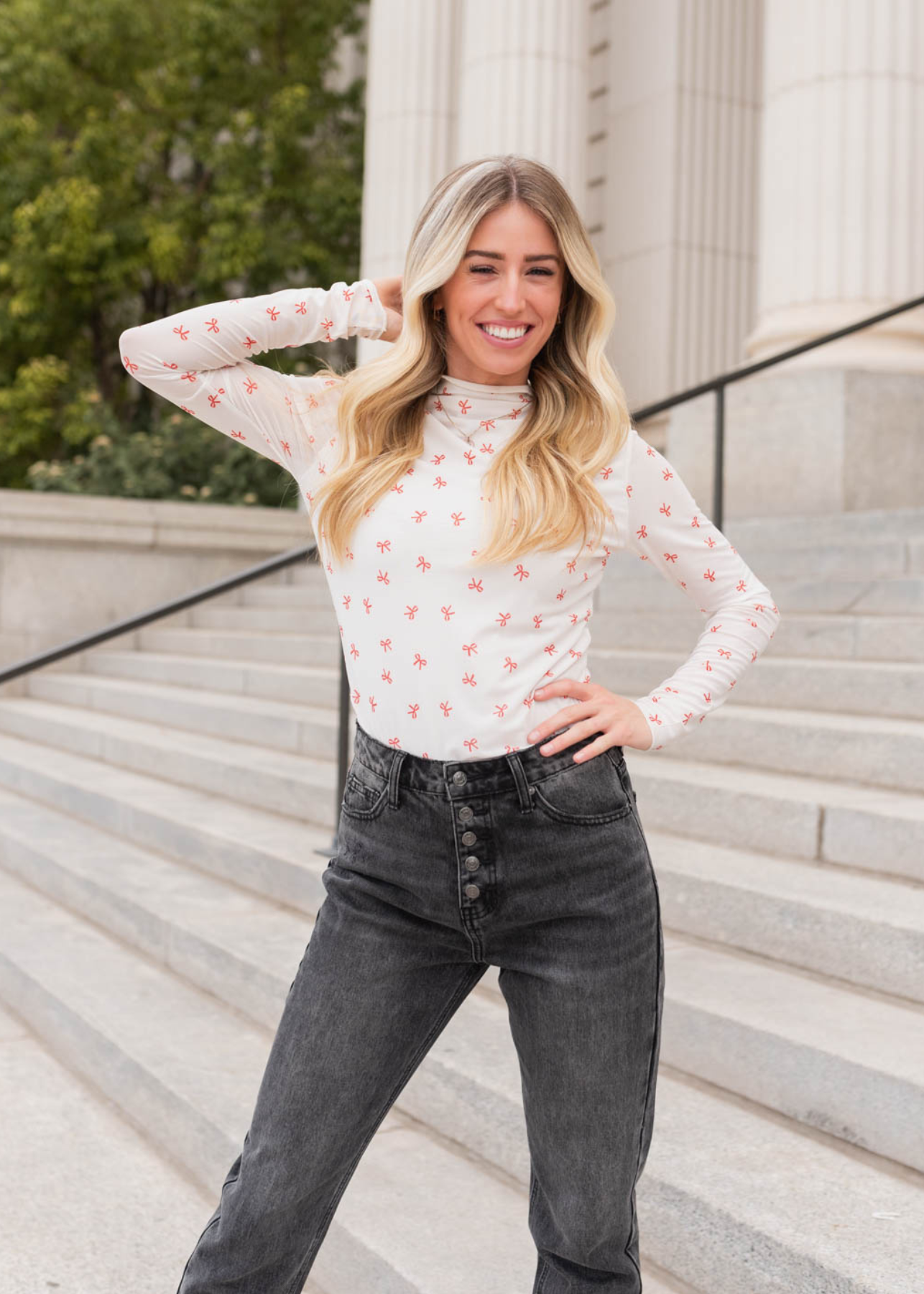 Ivory bow long sleeve top with orange bows