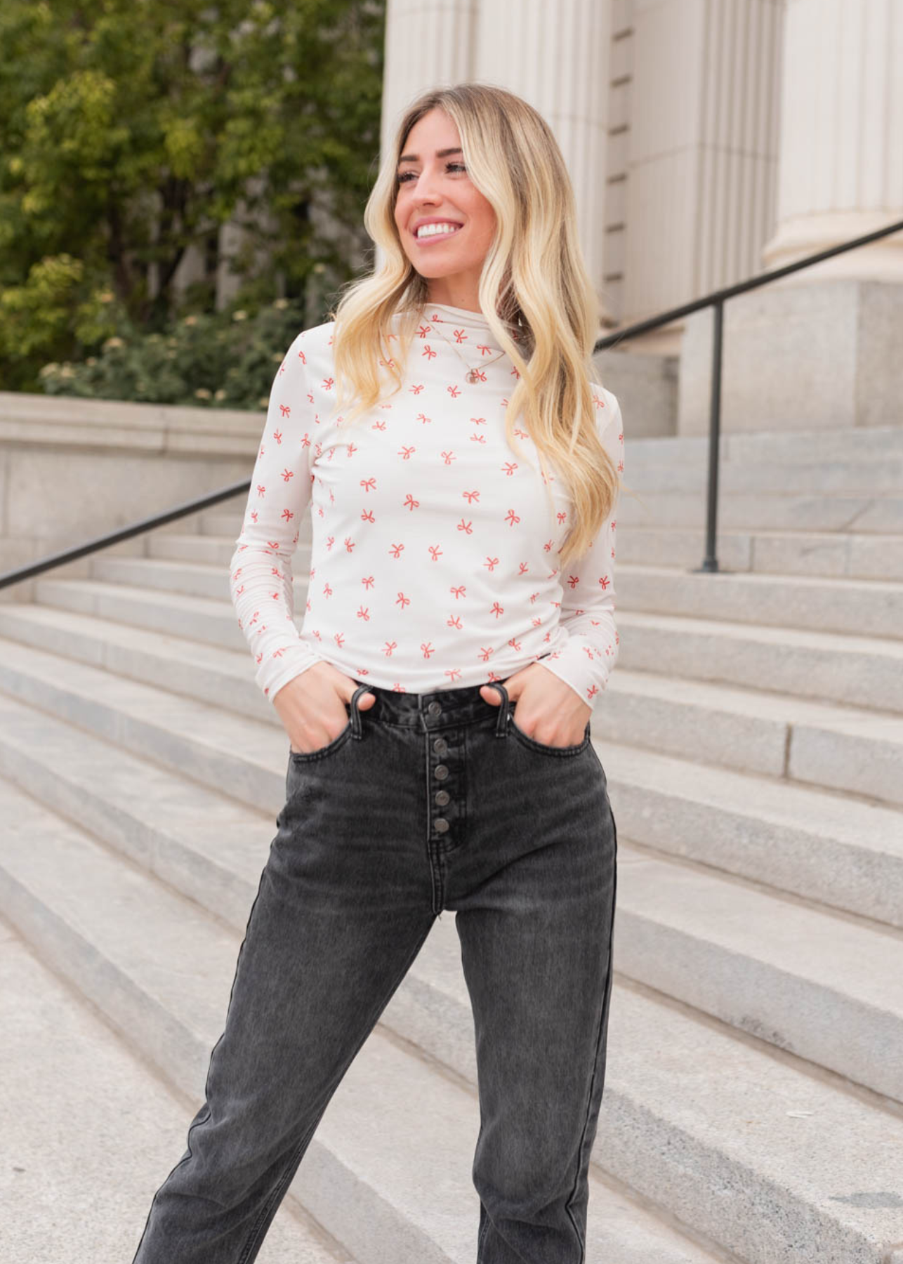 Small ivory bow long sleeve top