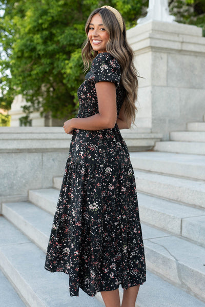 Side view of the black floral tiered dress