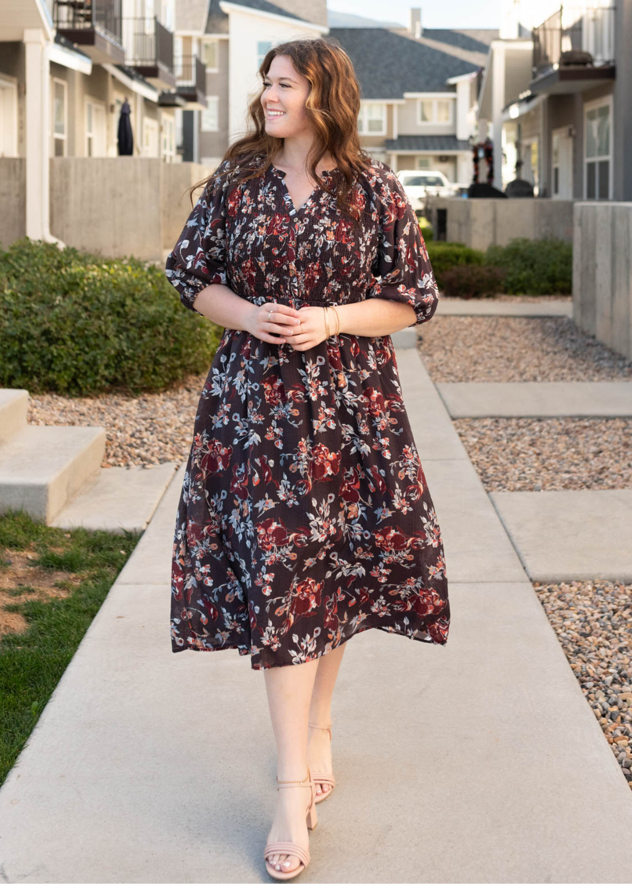 Smocked bodice on the plus size dark plum floral dres