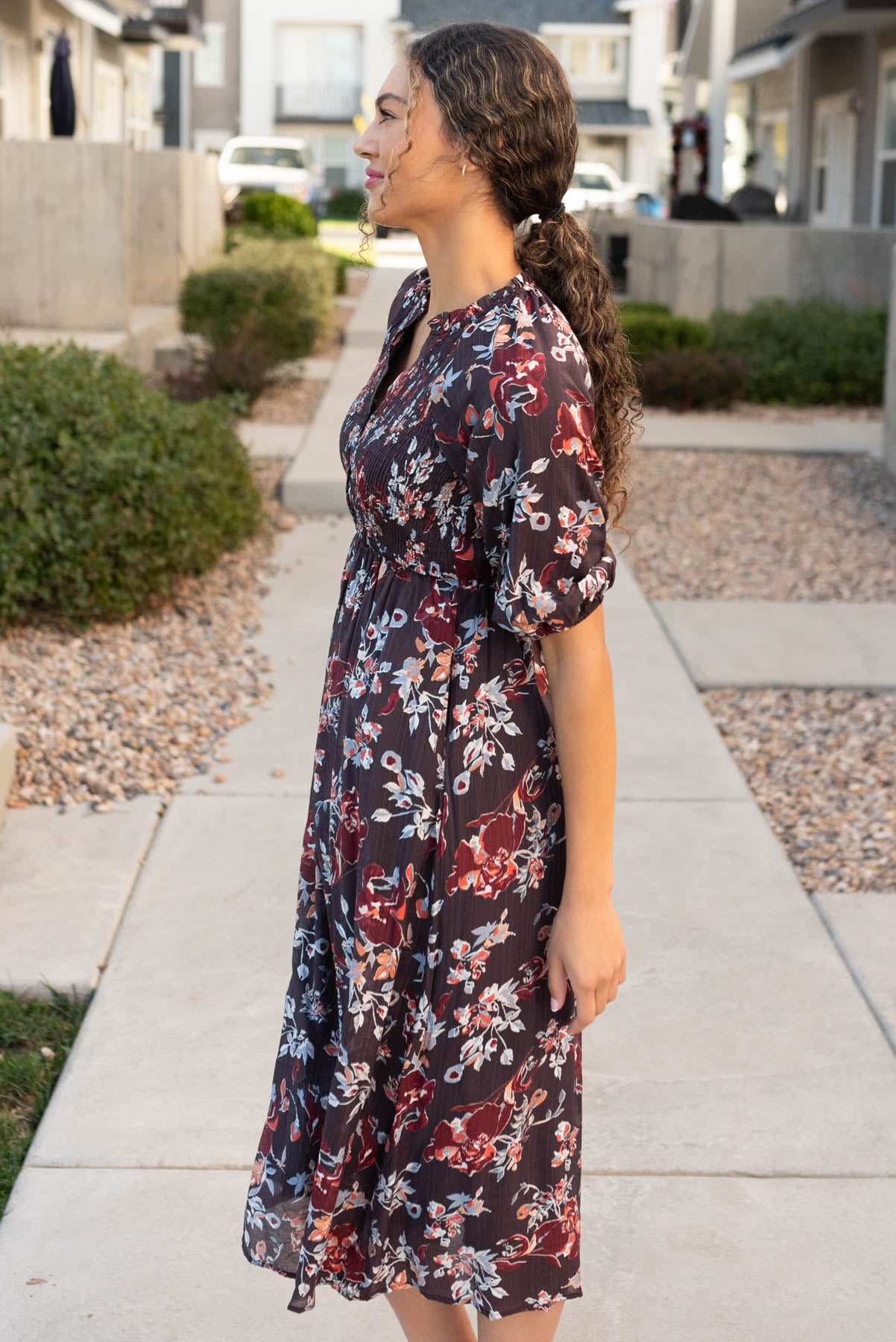 Side view of the dark plum floral dress