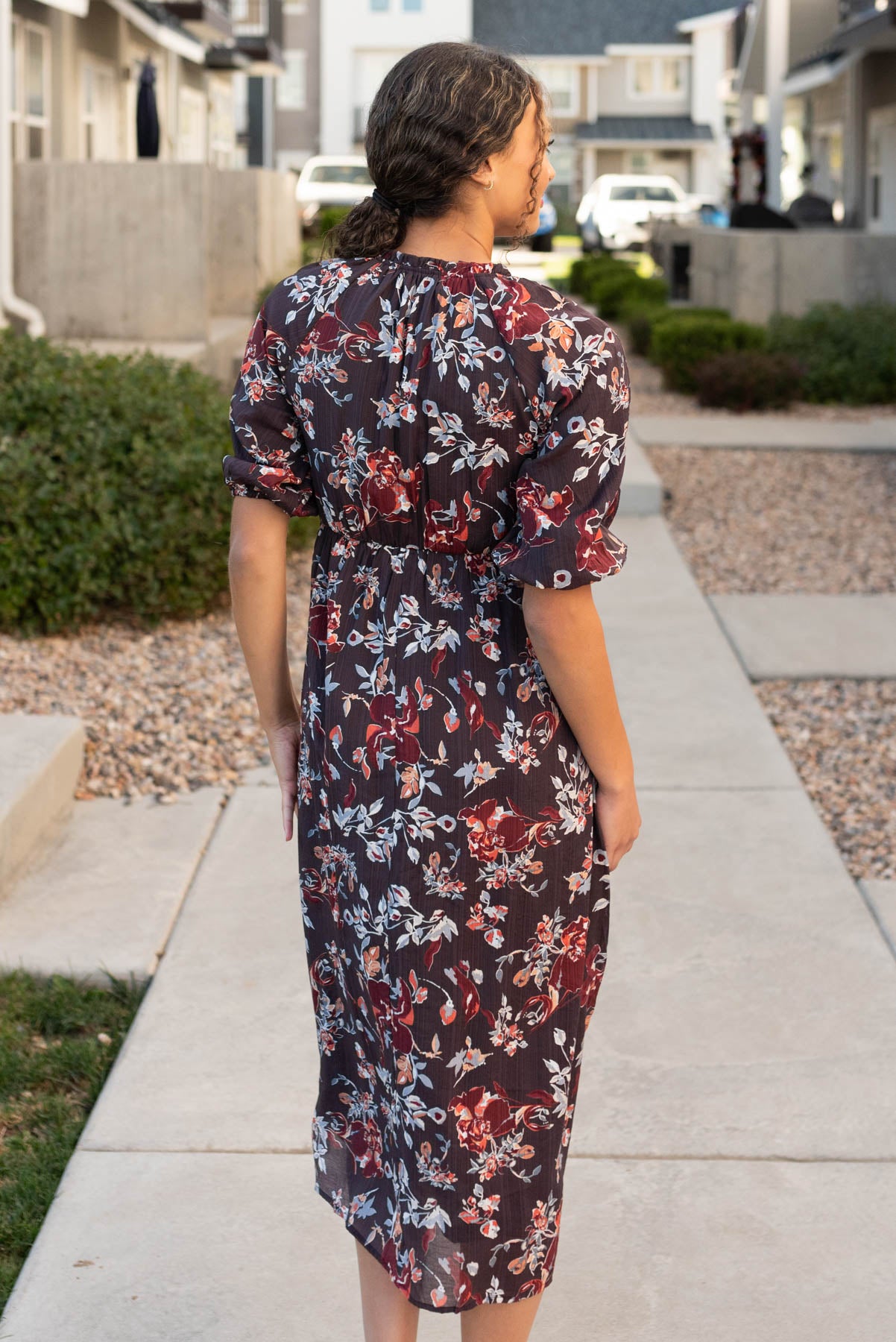 Back view of the dark plum floral dress