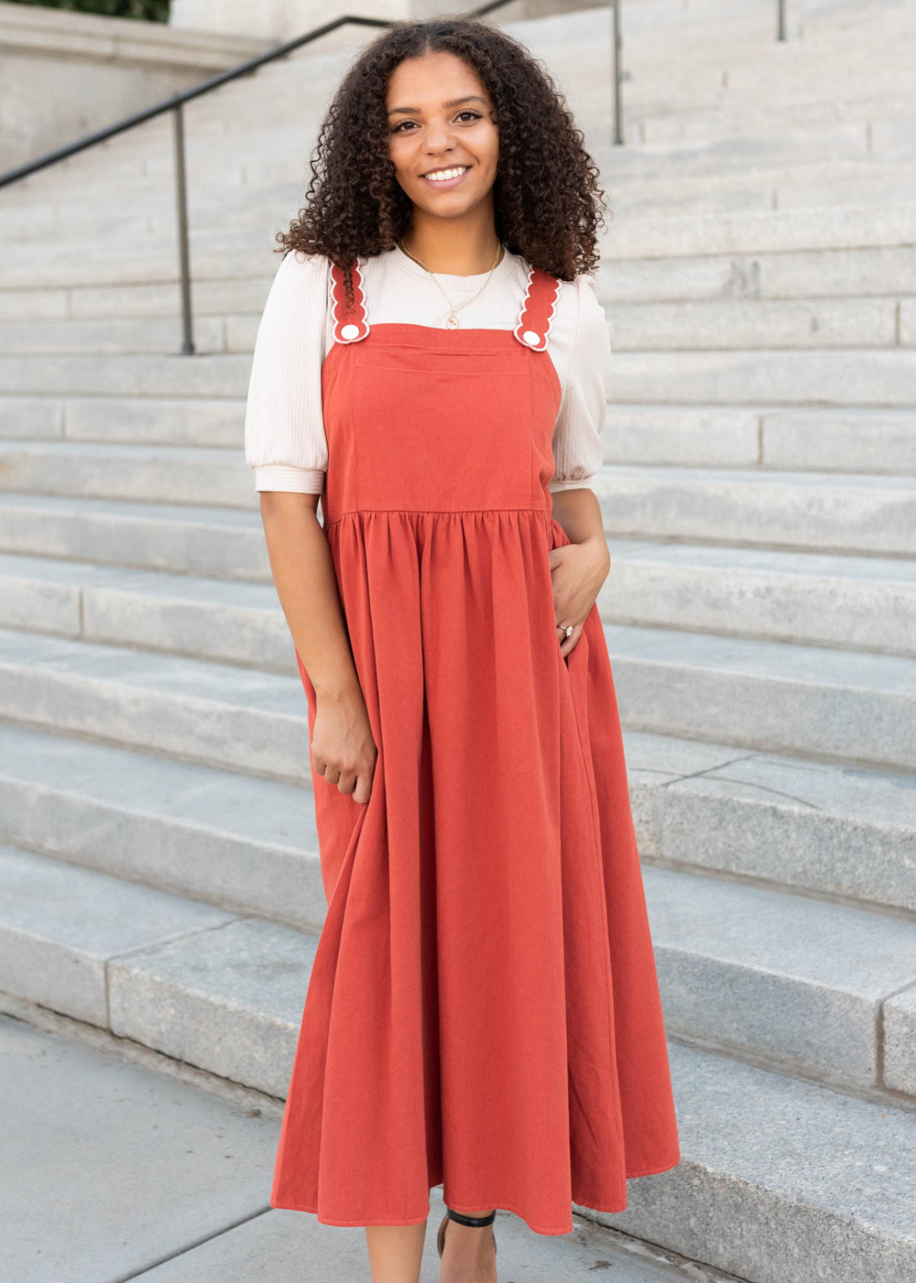 Front view of the burnt orange oveall dress