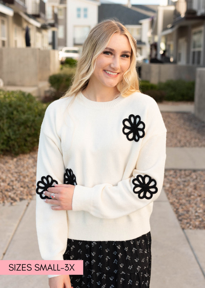 Black daisy cream floral sweater