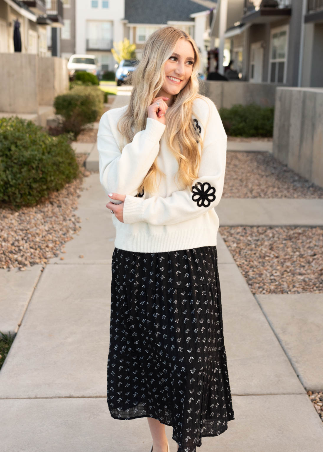 Cream floral sweater with black flowers