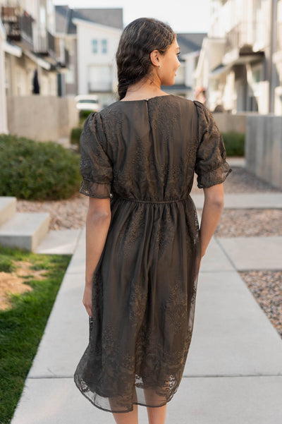 Back view of the dark olvie embroidered dress