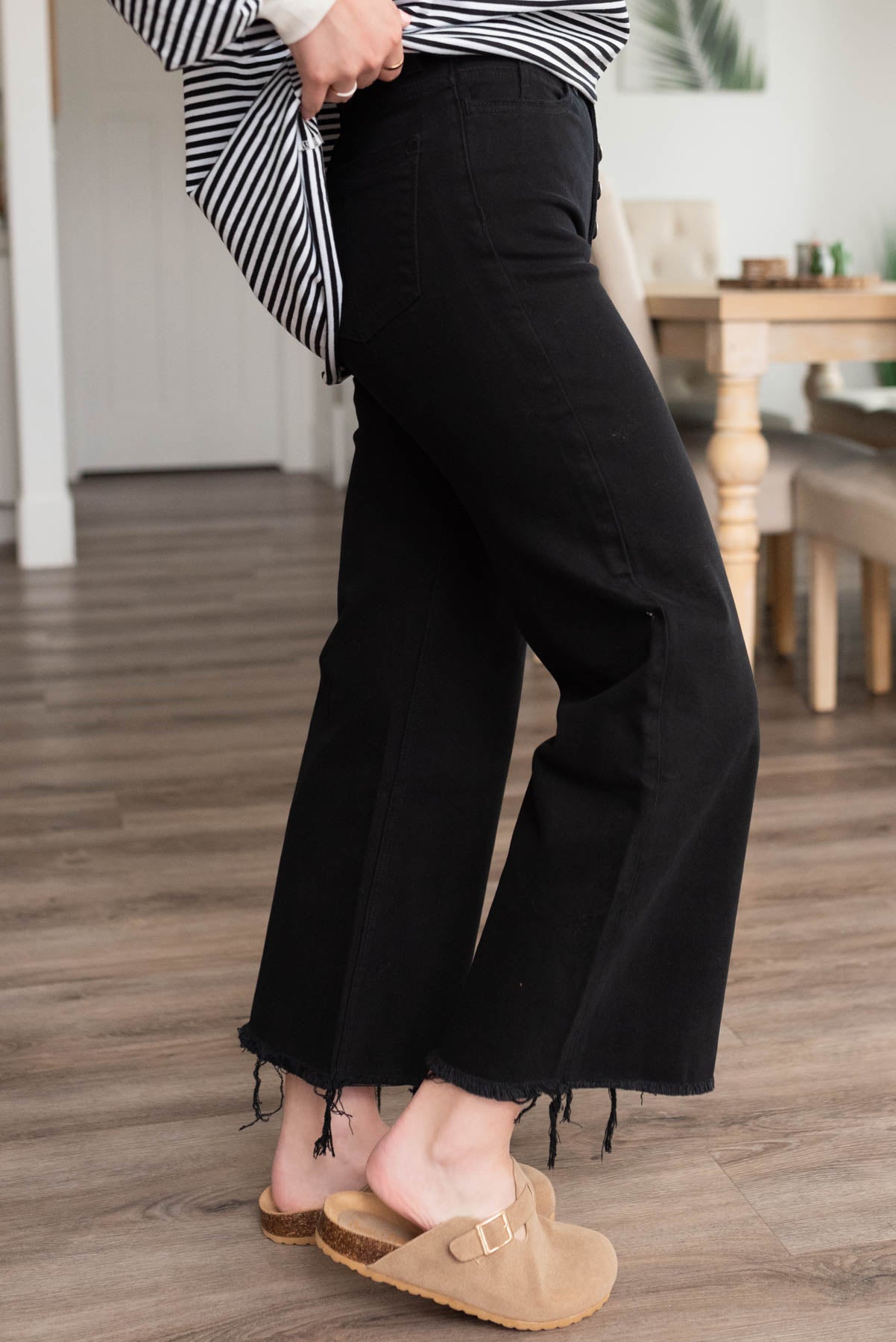 Side view of the black high rise wide leg pants