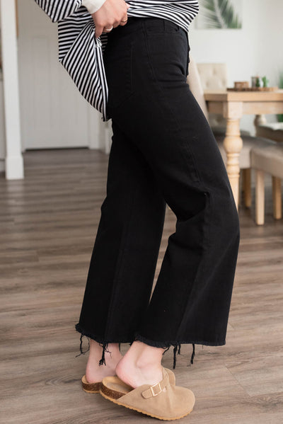 Side view of the black high rise wide leg pants