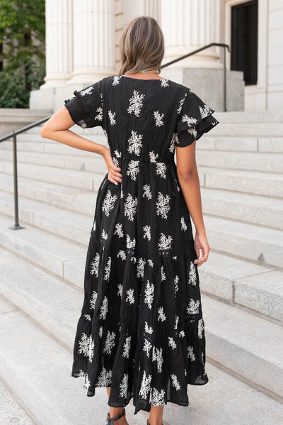 Back view of the black embroidered tiered dress