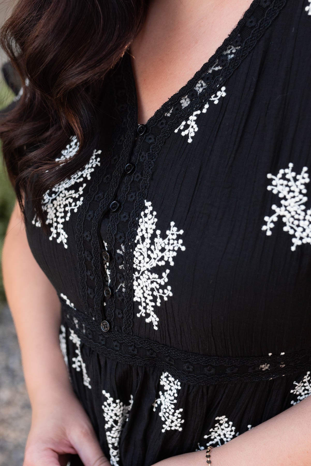 Cloes up of the bodice on the plus size black embroidered tiered dress