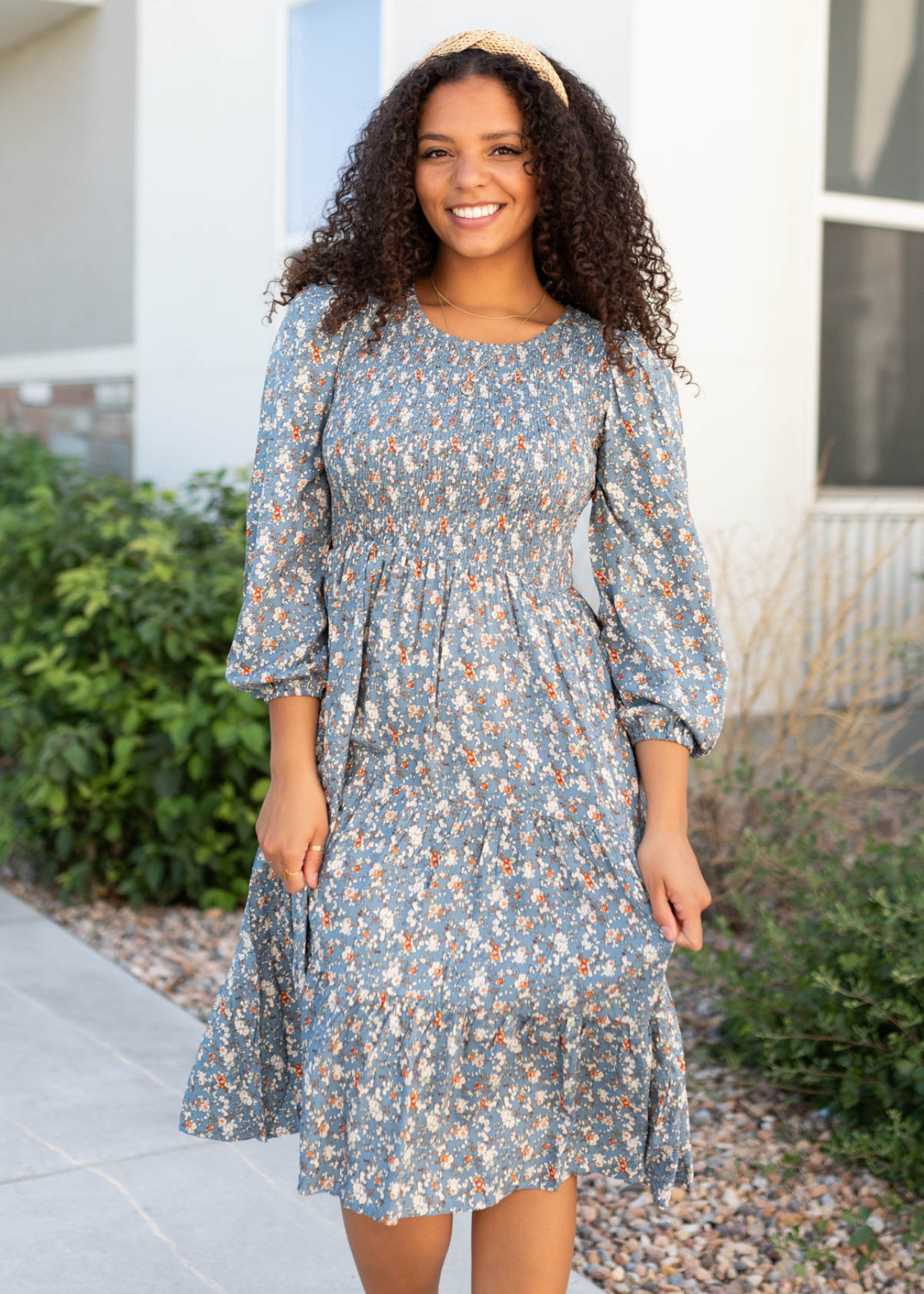 Blue floral smocked dress with ruffle on the skirt