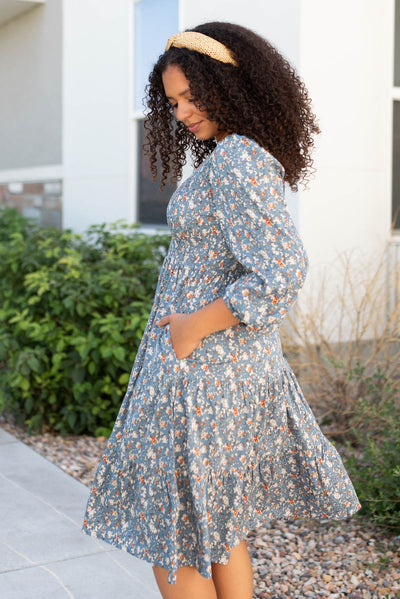 Side view of the blue floral smocked dress