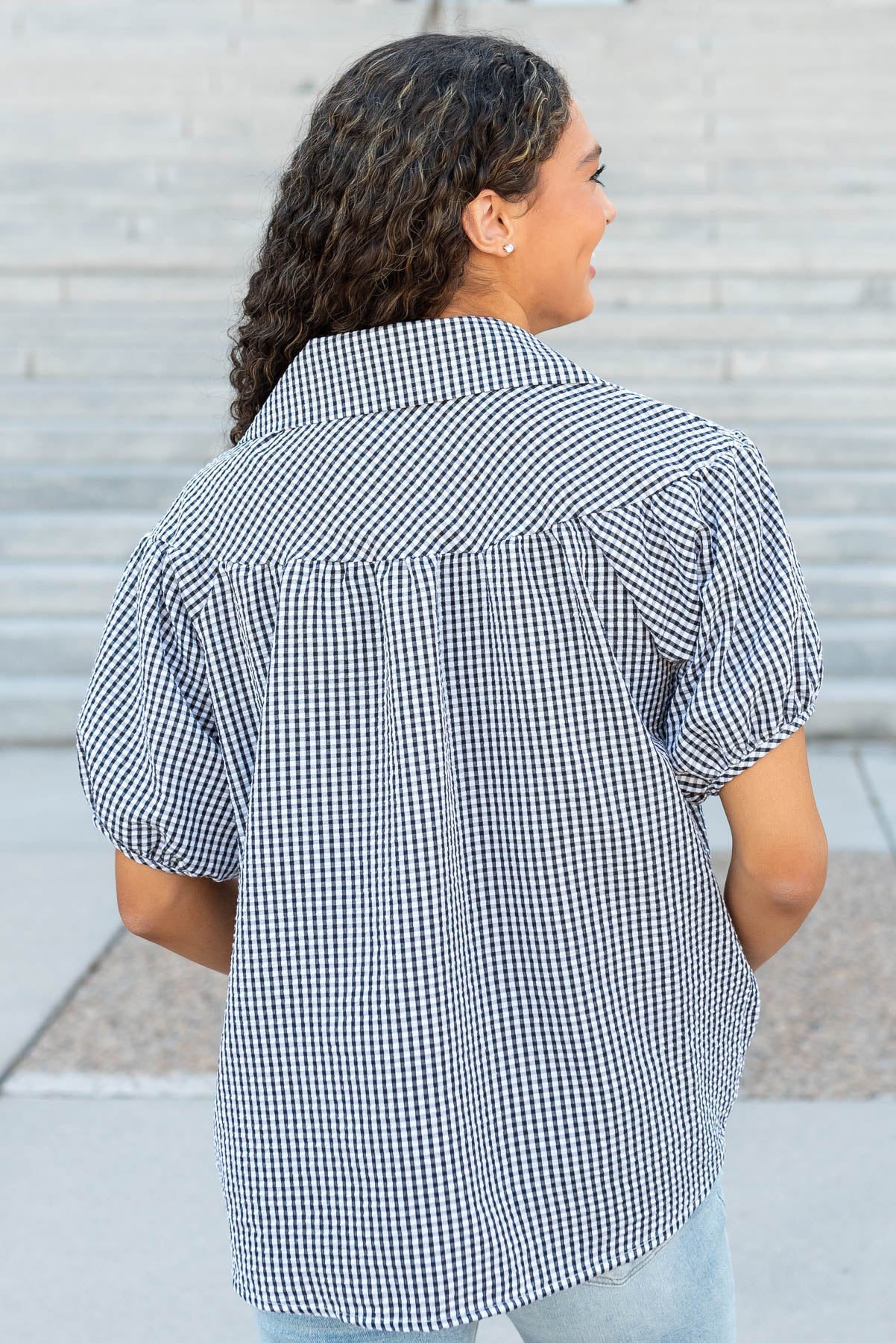 Back view of the black plaid collared top